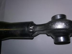 Swivel link welded on reverse thread end